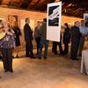 Guests mingling with the artwork.