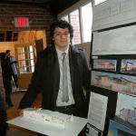 Student Andres Rincon displays his designs and model for the Art House.